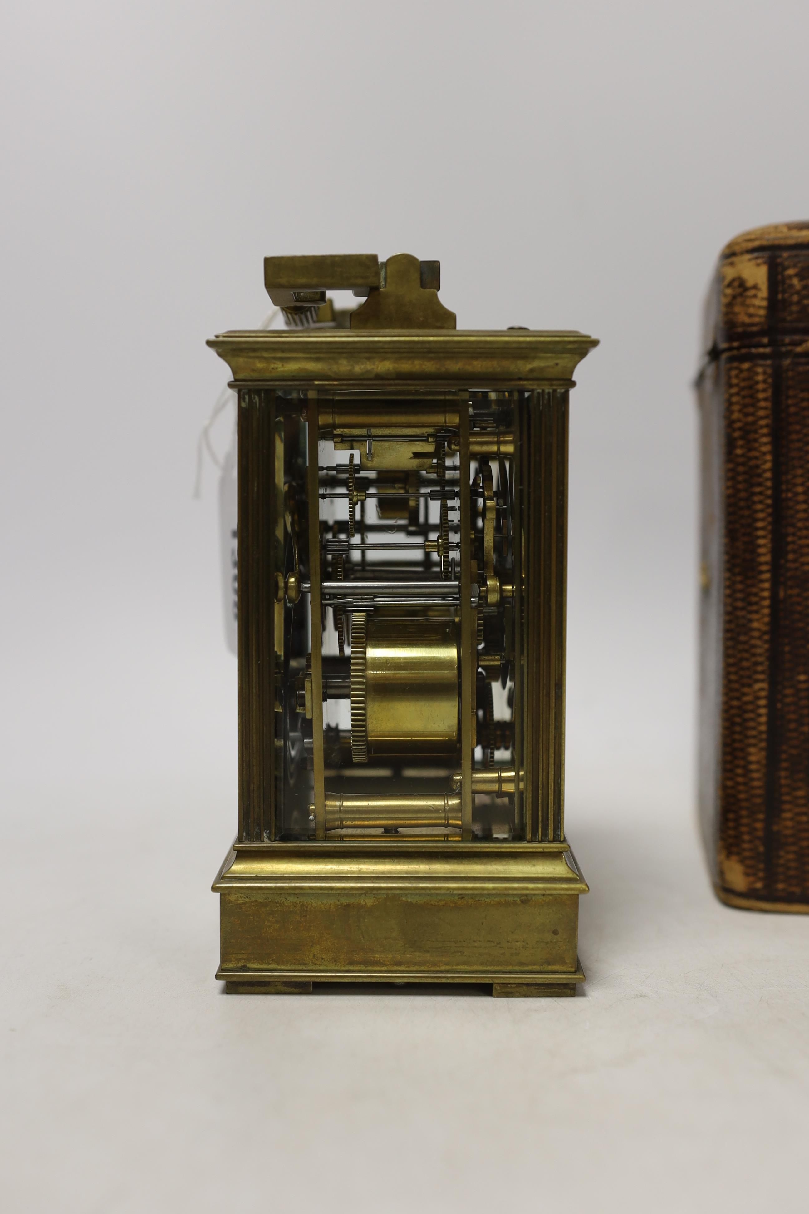 A cased early 20th century brass repeating carriage clock with alarm, 15.5cm